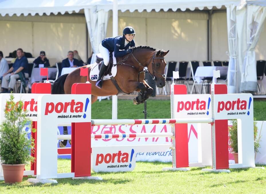 STAR: Jamie Priestley clears a jump while competing at the German Friendship Games.