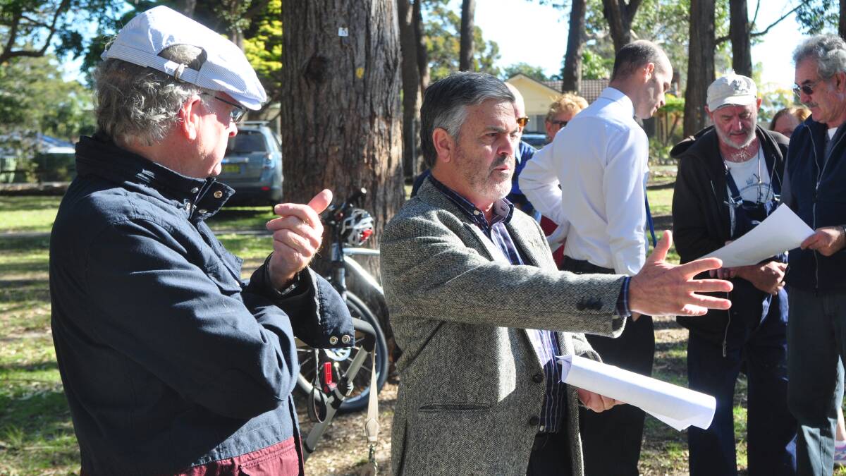 CHANGES: Council’s Tourist Parks manager Kevin Sullivan (right) and a local resident enjoy a debate over moves to change a camping area to a site for caravans.