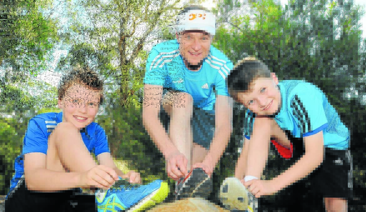 READY TO RUN:  Luke, David and Dan Hunter can’t wait for this weekend’s Orange Colour City Running Festival. Photo: JUDE KEOGH      0227runners2