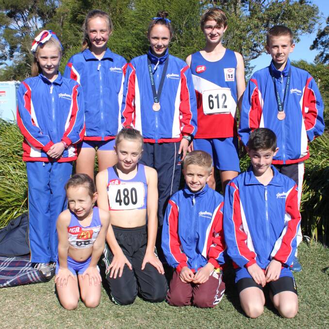 PROUD: Shoalhaven athletes (back) Victoria Kennedy, Clare Dobson, Jade Mustapic, Cameron Musgrove, Hugh Dobson, (front) Alisha Mustapic, Leah Dobson, Alec Dobson and Jesse Buckham at the Little Athletics NSW 2014 State Cross Country and Road Walks on Sunday. 