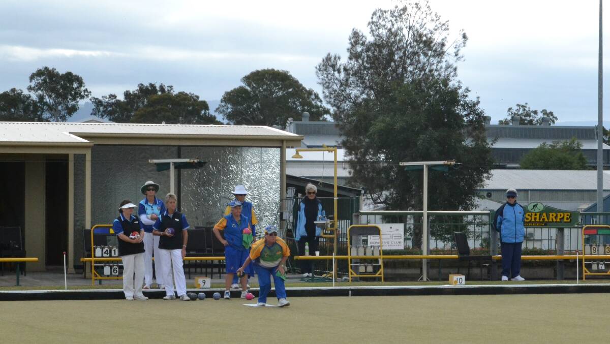 PLENTY OF ACTION: Jan Rolph bowls a ball at the State Lawn Bowls Carnival at Bomaderry Bowling Club. 