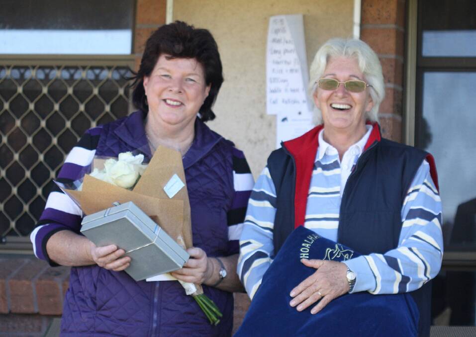 HARD YARDS: Outgoing Shoalhaven Dressage Club committee members Gayle Loose and Toni Crossley are celebrated at the club’s June competition.  