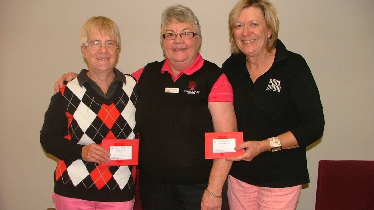 SUCCESS: The winners of the WGI Trophy Day at Vincentia on Tuesday Jill Varty and Dale Holland being congratulated by Barb Howsan (vice president WGI). 