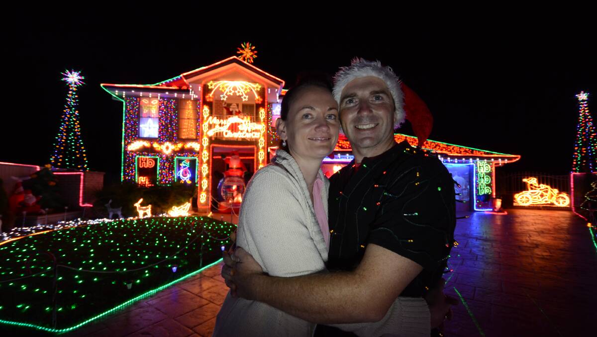 Brenda and Scott Morrison with their famous Christmas lights display.