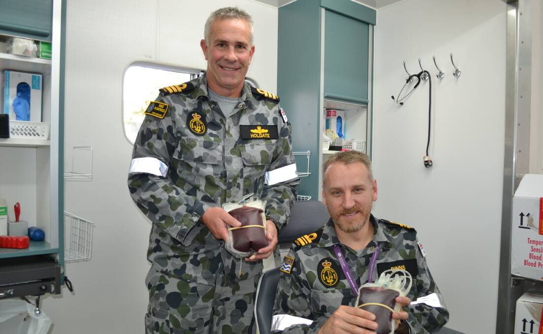 Commander Gary Holgate and Lieutenant Commander Alex Binns were among volunteers from HMAS Albatross and Creswell who rolled up their sleeves and gave blood on Monday for the Defence Blood Challenge. 