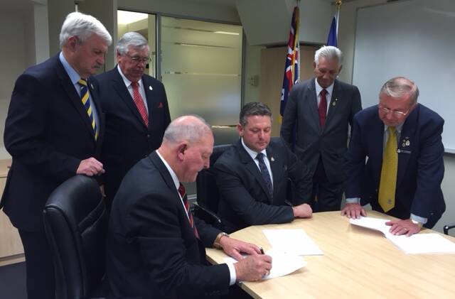 Glenn Kolomeitz at his contract signing at Anzac House in Sydney on Thursday. 