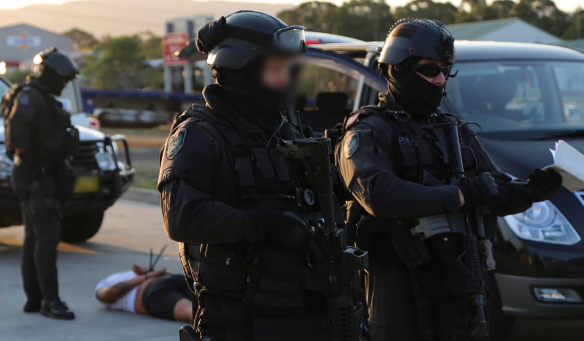 Heavily armed police officers take part in co-ordinated drugs raids in the Shoalhaven and Lake Illawarra.
