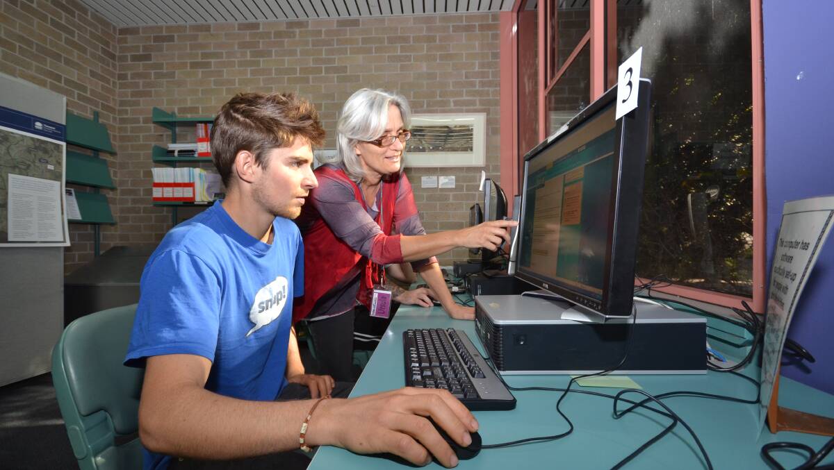 Ursula Rentz from Nowra Library shows visitor Remi Valran some of the finer points of using the facility’s digital offerings. A free Technology Tune-up night will be held at the library on Friday.
