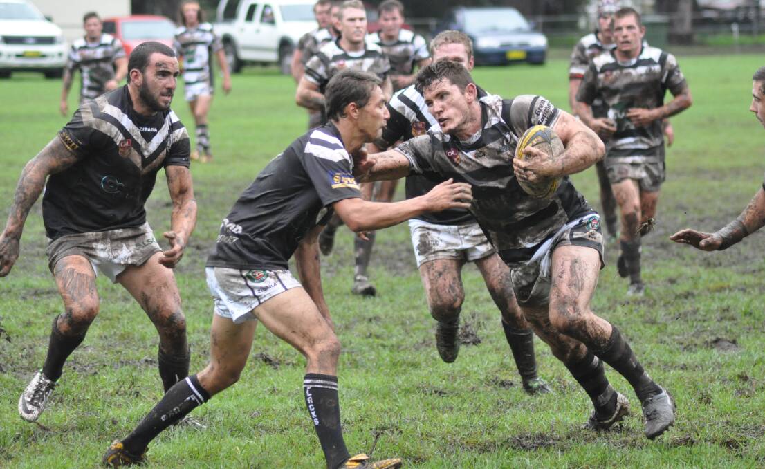 DIRTY DEEDS: Berry Magpies captain coach Nathan Benney brushes Port Kembla’s Josh Maude aside during their 30-4 victory on Saturday. Photo: PATRICK FAHY  