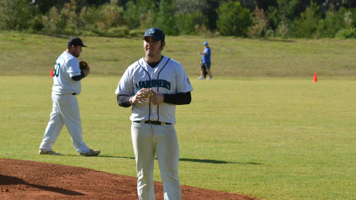 PLENTY OF ACTION: Blake Mitchell prepares to throw the first pitch at Saturday's official opening. Photo: PATRICK FAHY 