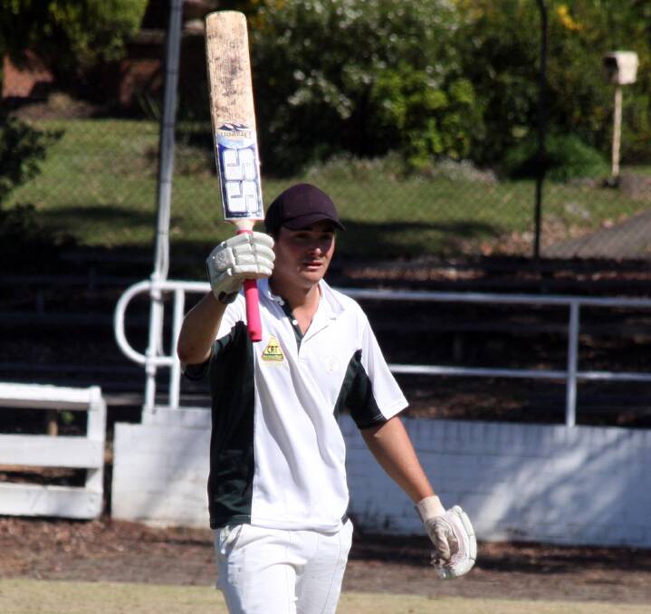 RAISE YOUR BAT: Nowra’s Daniel Bryant raises his bat after bringing up a century against Bay and Basin at Nowra Showground on Saturday. Photo: CATHY RUSSELL  
