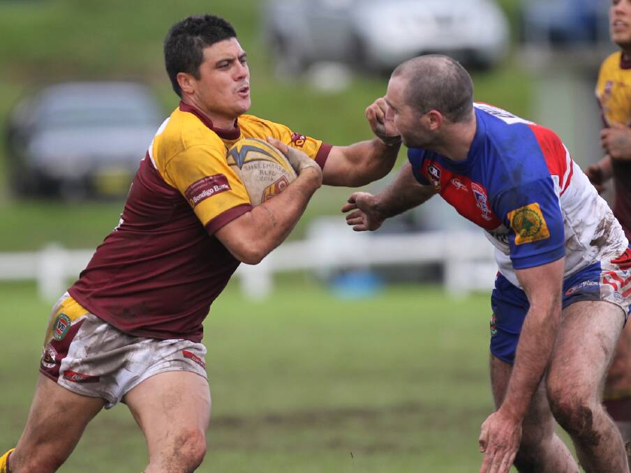 PUSH AND SHOVE: Shellharbour Sharks centre Bronx Goodwin prepares to brush off Gerringong’s Peter Cronin during the Sharks 16-10 win at Ron Costello Oval. Photo: DAVID HALL  