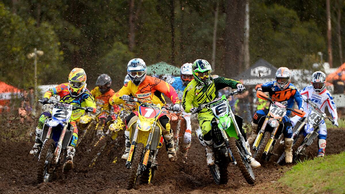SIBLING RIVALRY: Twin brothers Matt (number one) and Jake Moss (number six) battle it out during the second round of the 2014 Monster Energy MX Nationals in Appin. Photo: JEFF CROW- EXPLORER MEDIA.  