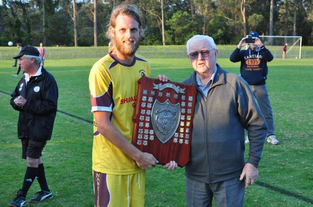 TROPHY TIME: Manyana captain Mitch Butel is presented the Boldon Blackmore Shield by one half of its namesake, Tom Blackmore.   