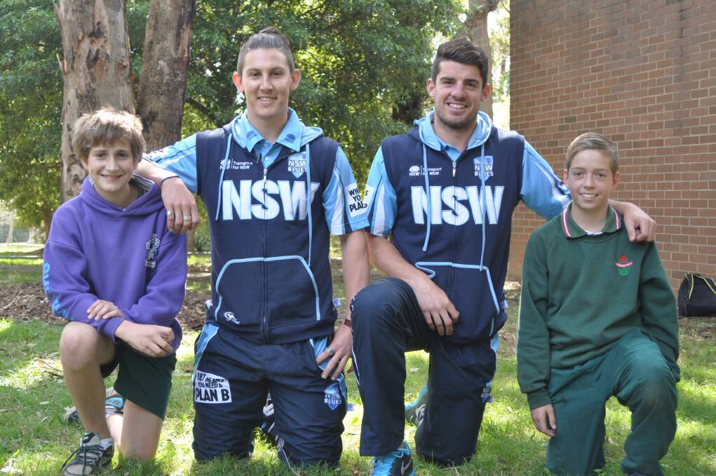 
YOUNG GUN: Bomaderry High School students James Batson and John Ulrich with Nic Maddinson and Moises Henriques. 
