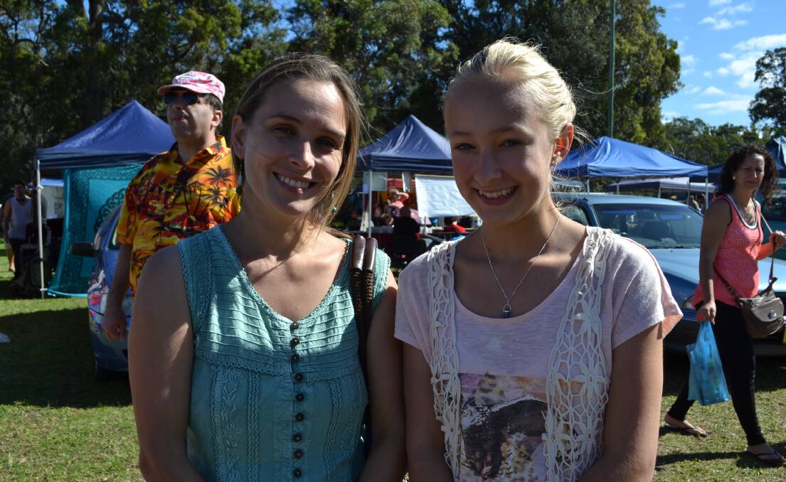 Belinda and Gemma Chapman from Canberra enjoy the White Sands Easter Festival at Huskisson on Saturday. 