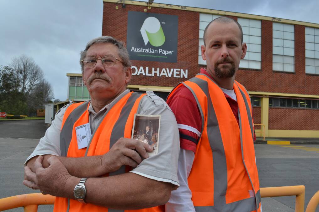 Former Shoalhaven Paper mill worker Roy Bennett from Worrigee with a picture of his father Harry, who worked at the mill before him and with his son Troy from Worrigee who also works there have a long history with the mill and have seen its decline over many years.