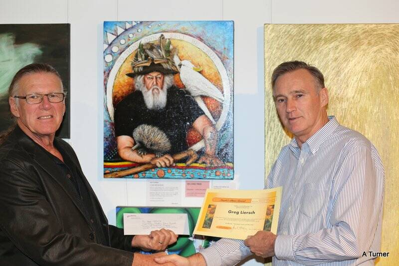 Greg Liersch from Milton, winner of the People’s Choice Award in the Shoalhaven Mental Health Fellowship art competition is presented with a certificate and cheque from Shoalhaven City Arts Centre and Regional Gallery manager Bruce Tindale, in front of Greg’s work, To thine own self be true.