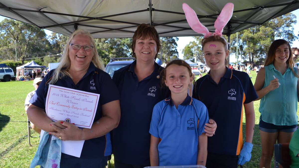 Liesel Turnbull, Sue Taylor, Penny Holloway and Jennifer Carroll from Huskisson Guides get into the Easter theme at the White Sands Easter Festival at Huskisson on Saturday.  
