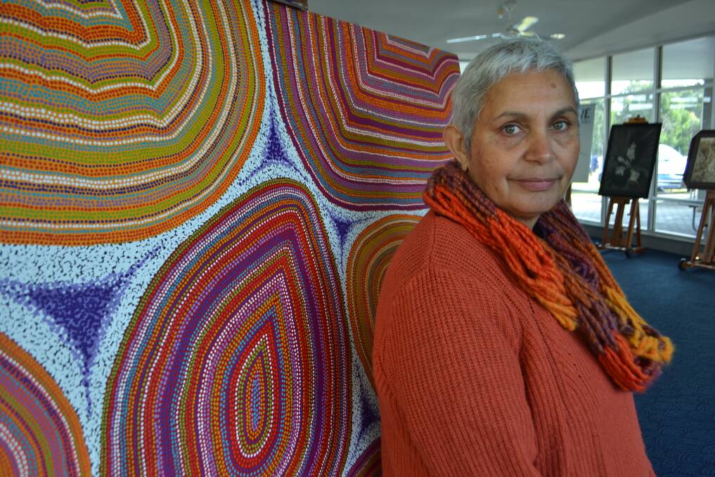 Kim Hill in front of one of her large-scale artworks.