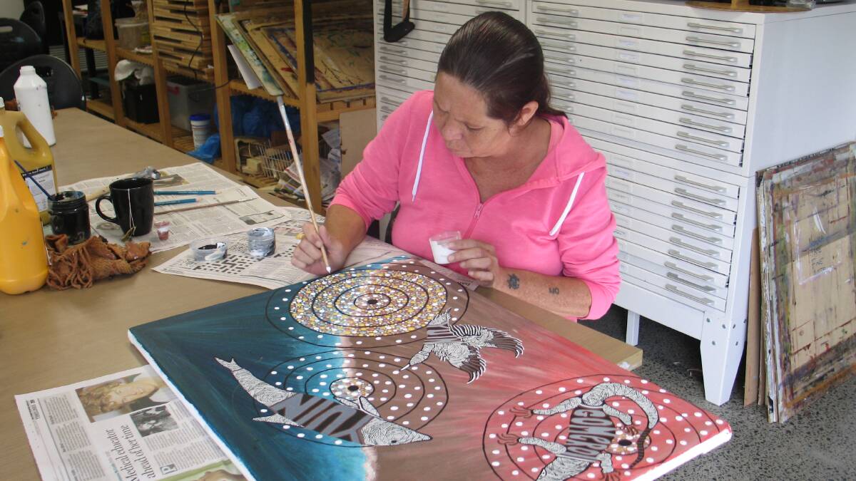 Trish Pittman works on her entry for the 2014 Nowra NAIDOC Week Art Exhibition and Black Cockatoo Art Awards.