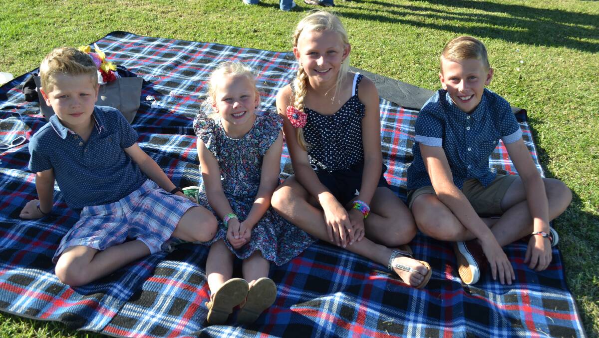 Samuel, Hannah, Sophie and James Phillips enjoy a picnic at the 2014 Greenwell Point Cup day at the Shoalhaven City Turf Club on Sunday. 
