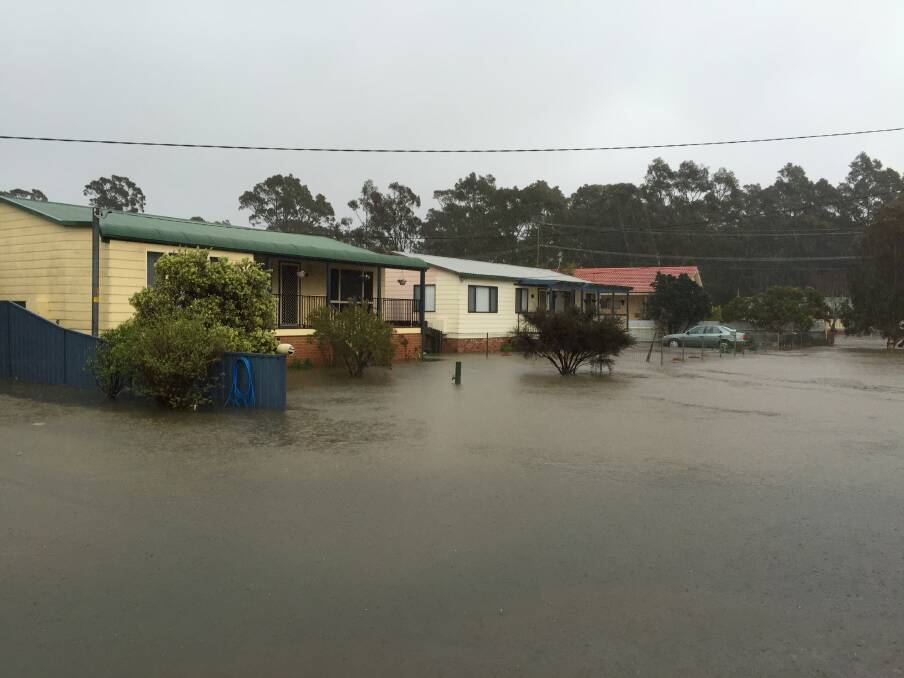 Floodwaters threaten homes at Sanctuary Point.