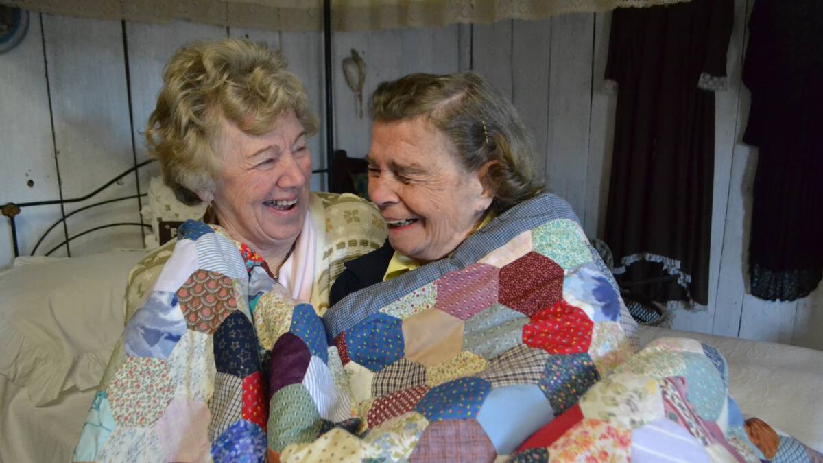 Elaine Apperley and Wyn Grant, both volunteers at Kangaroo Valley Pioneer Museum, cuddle up in one of the rooms on a cold winter’s afternoon.