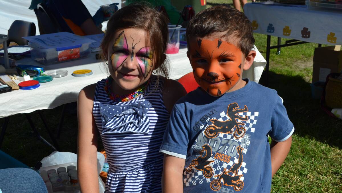 Sophira and Syrus Fanaian from Nowra have their faces painted at one of the many stalls at the White Sands Easter Festival at Huskisson on Saturday. 