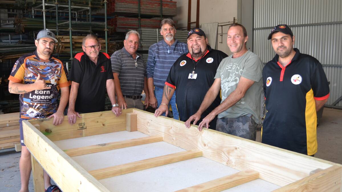 Some of the men from Shoalhaven Jarmbies with a completed raised garden bed they made, Scott Whitfield from Bomaderry, Ronald Austin from East Nowra, TAFE teachers Bob Brown and Mark Willers, Shane Friend from Aboriginal Medical Service, Kerry Longbottom from Nowra and Antonio Williams from Sanctuary Point.