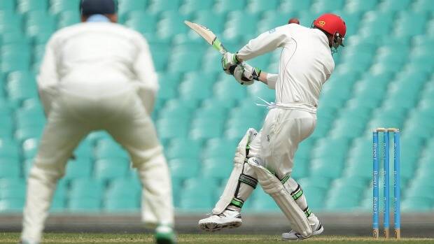 The moment of impact: Hughes is struck under the left ear. Photo: Getty Images
