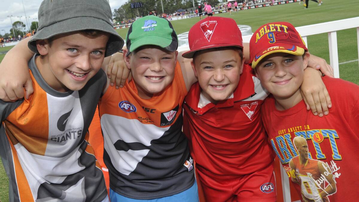 AFL: Spectators, from left, Noah Macdonald, 12, Tom Kohlhagen, 10, from Wagga, with twins Tom and Charlie Bourne, 9, who are from The Rock. Picture: Les Smith