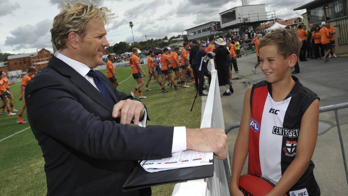 AFL: Fox Sports commentator Dermott Brereton chats to St Kilda fan Josh Connellan, 13, from Wagga. Picture: Les Smith
