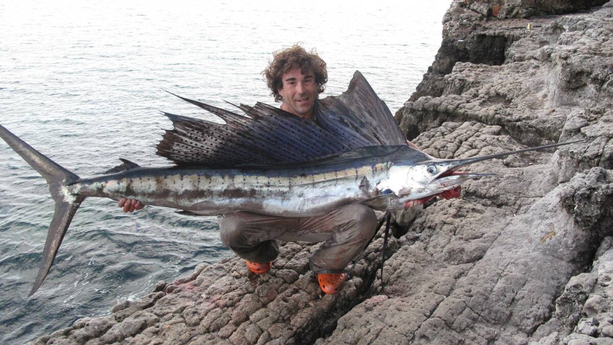 RARE CATCH: Wollongong land-based game fisherman Jason Stanley with his unusual sailfish catch earlier this year.