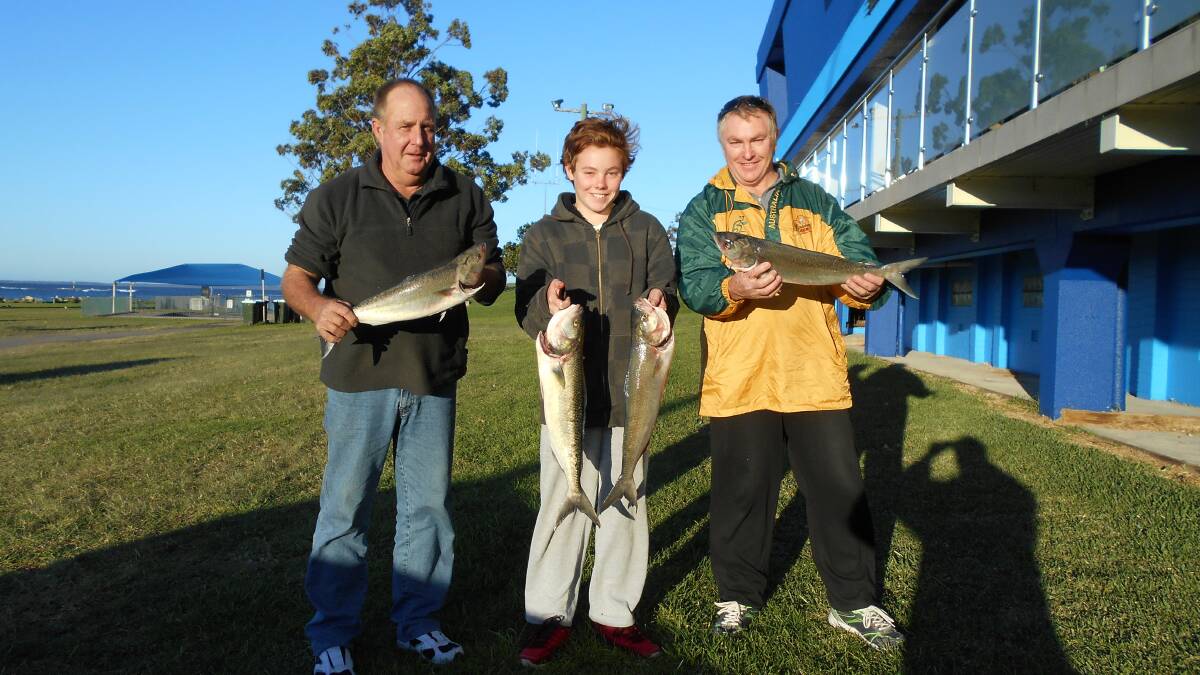 BAG A SALMON: Wayne Smith, Jack Reminis and Mark Reminis show off some salmon samples from the last fish out.