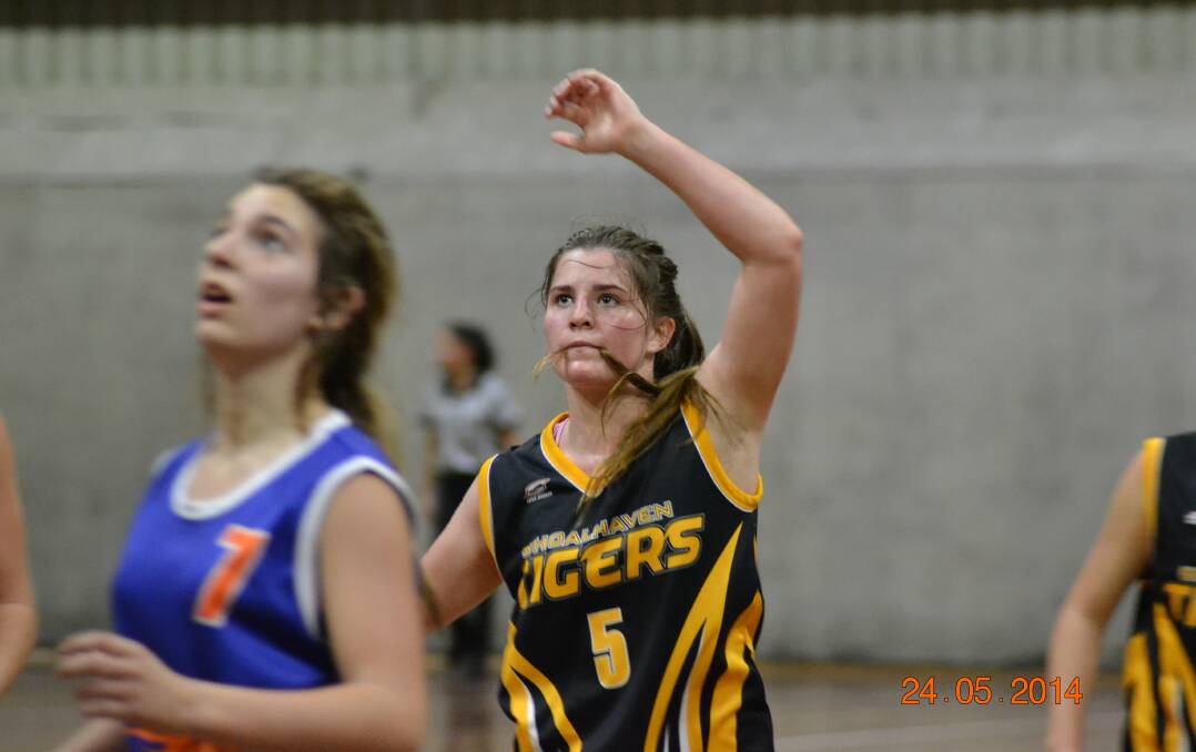 TENSE: Under 18 Shoalhaven Tiger Bridget Kellett watches to see if her shot goes in.