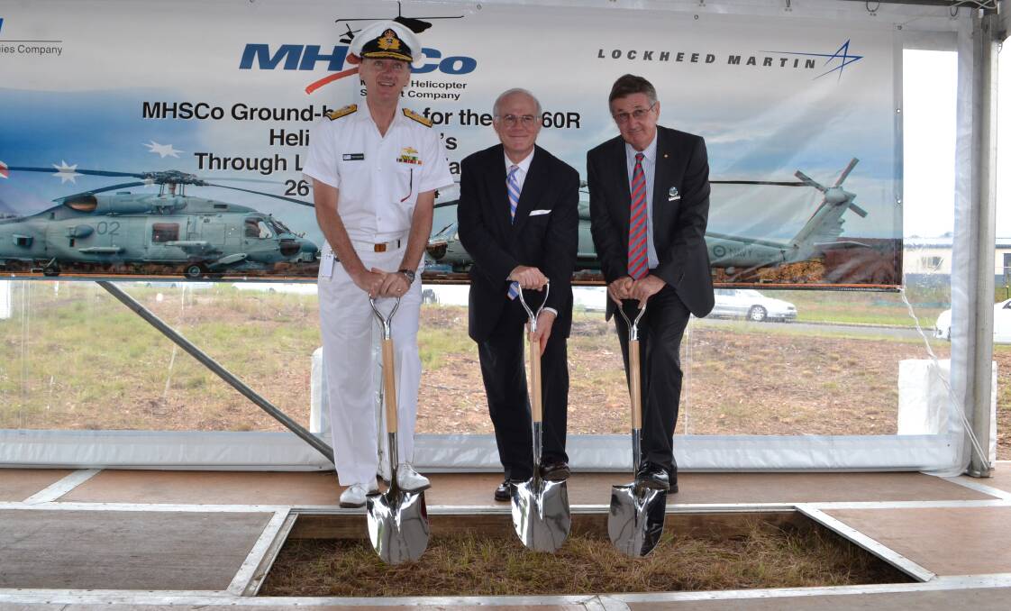 PROGRESS: Maritime Helicopter Support Company (MHSCo) president Rod Skotty is joined by Defence Materiel Organisation’s Helicopter System Rear Admiral Tony Dalton and Shoalhaven City Council Assistant Deputy Mayor Alan Baptist to turn the first sod for the $35 million complex at the Albatross Aviation Technology Park.