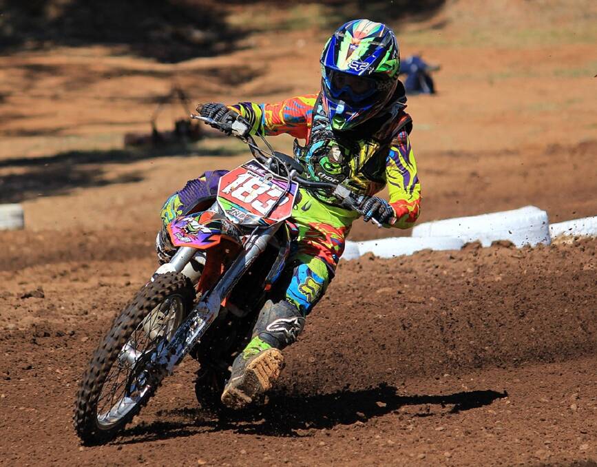 ON THE HUNT: Chloe Bowers tears through the dirt at the 2014 NSW Motocross Championships. 	Photo: JARROD MULVIHILL