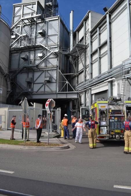 EMERGENCY: Manildra staff evacuate the Bomaderry factory after a fire in a high voltage electrical substation on Tuesday morning.