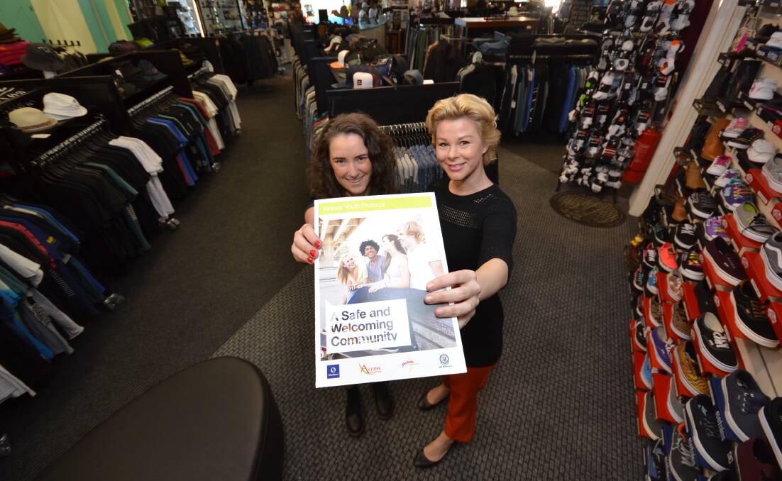 MAKE A DIFFERENCE: Aquatique Surf Shop manager Sarah Aldous and Marnie Lupton from the Nowra CBD Promotions Committee encourage other local businesses to get involved with the Nowra Youth Protocol.