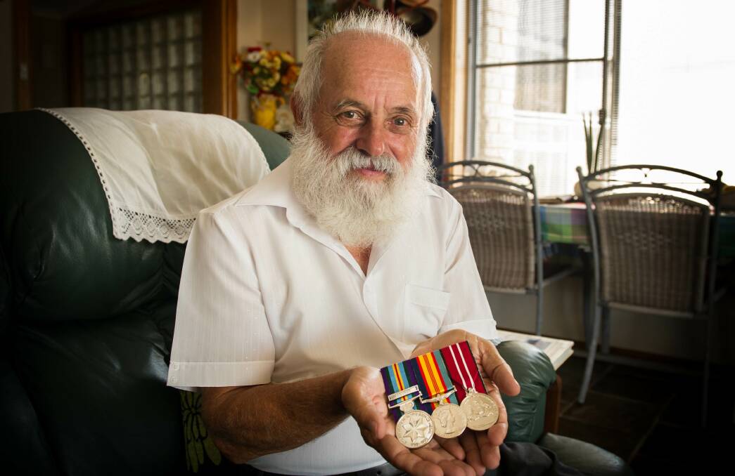 PROUD: John Zarb displays his medals after finally having his war service recognised. 	 Photo ALBEY BOND.