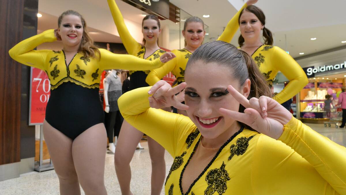 BRIGHT PERFORMANCE: Dancers from Diamond Calisthenics, Angie Eyles, Brooke Furey, Katelyn Kirby, Keighlan Roach and Elicia Dearsley entertained the crowd at Stockland Nowra during the Youth Week event on Thursday.  