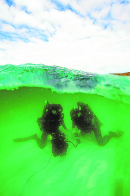 DIFFICULT SHOT: Able Seaman Jesse Rhynard’s award winning photograph of navy clearance divers during an exercise in Jervis Bay.