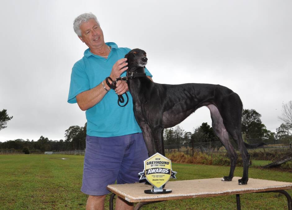 MAJESTIC: Nowra Hill greyhound trainer Garry Edwards shows off joint winner of the NSW Greyhound of the Year award, Double Twist.