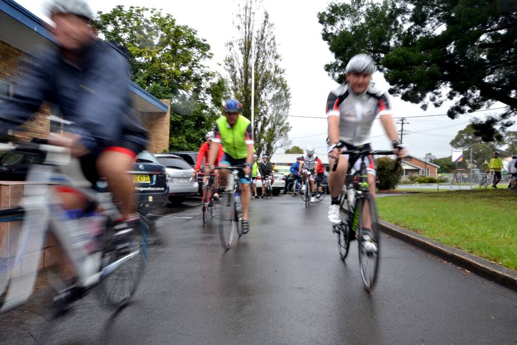 LONG ROAD AHEAD: Cyclists left the Manildra office in Bomaderry under stormy skies on Tuesday morning. They are riding 630 kilometres to raise money for the McGrath Foundation and Beyond Blue.