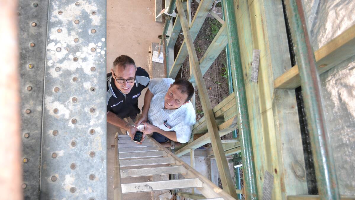 SAFETY FIRST: WorkCover Nowra district co-ordinator, John Patton (left) and David Reid Homes supervisor Fabian Witenden discuss the new safety video to help prevent falls through stair voids.