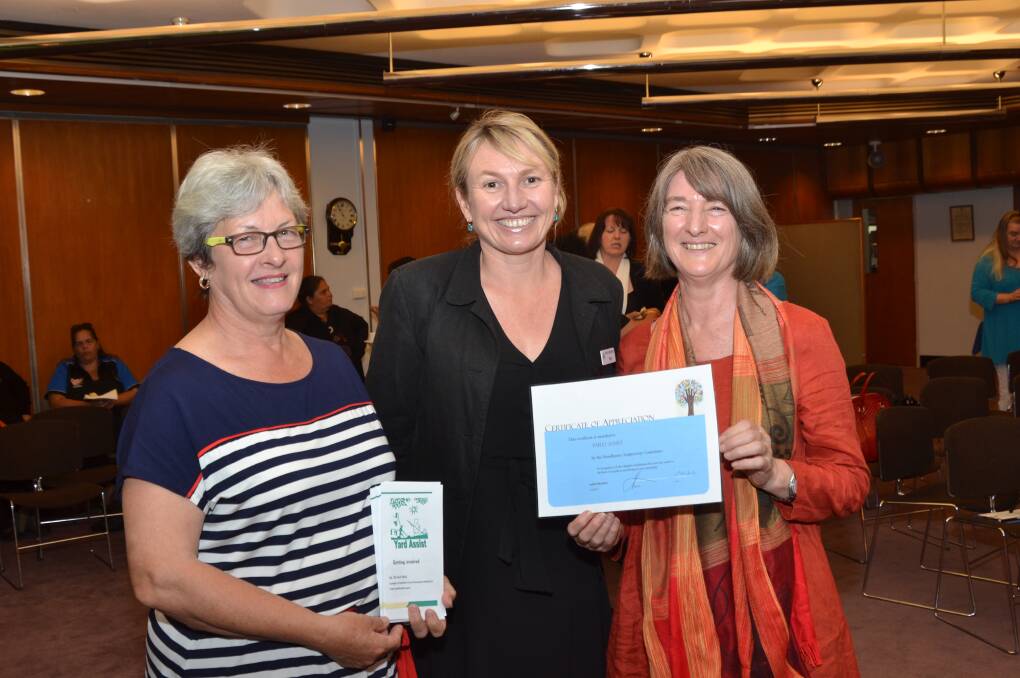 SPECIAL THANKS: Yard Assist volunteer supervisor Elva Kielly and Southern Cross Community Housing community development officer Penni Wildi receive a certificate of thanks from Shoalhaven Anti-Poverty Committee facilitator Judith Reardon.