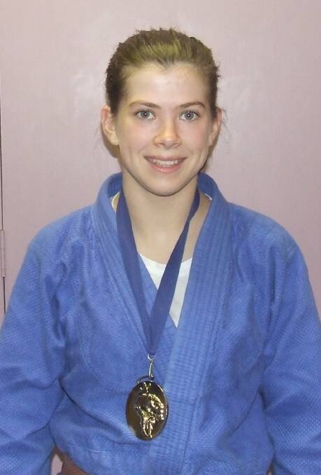 CHAMPION: Easton celebrates winning her third straight Oceania Judo Championship.
