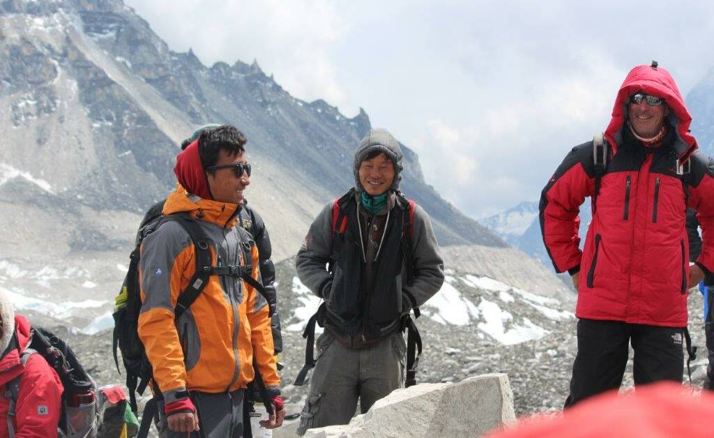 PREPARE: Sherpa guides help Frank de Graaf prepare for his acclimatisation climb at base camp.