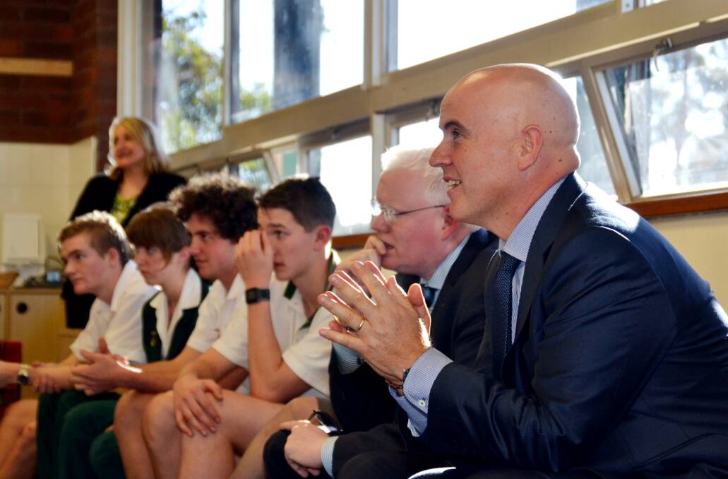 LEARNING CURVE: NSW Education Minister Adrian Piccoli speaks with students at Bomaderry High School during his visit to the Shoalhaven on Tuesday.